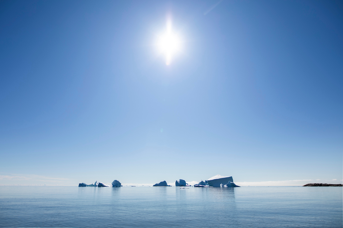 Icebergs Under Sun. Aningaaq Rosing Carlsen Visit Greenland