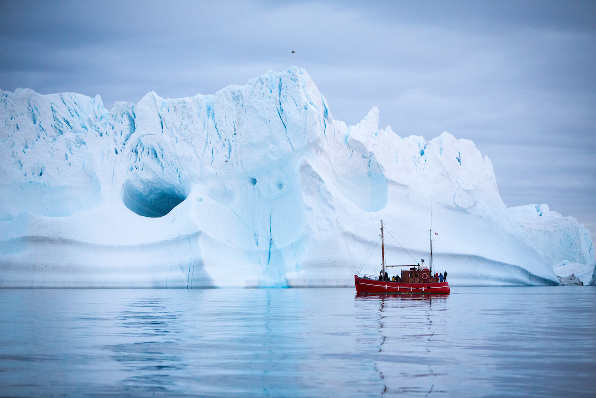 Boat Tour Passing Iceberg, Ilulissat. Photo Paul Zizka , Visit Greenland