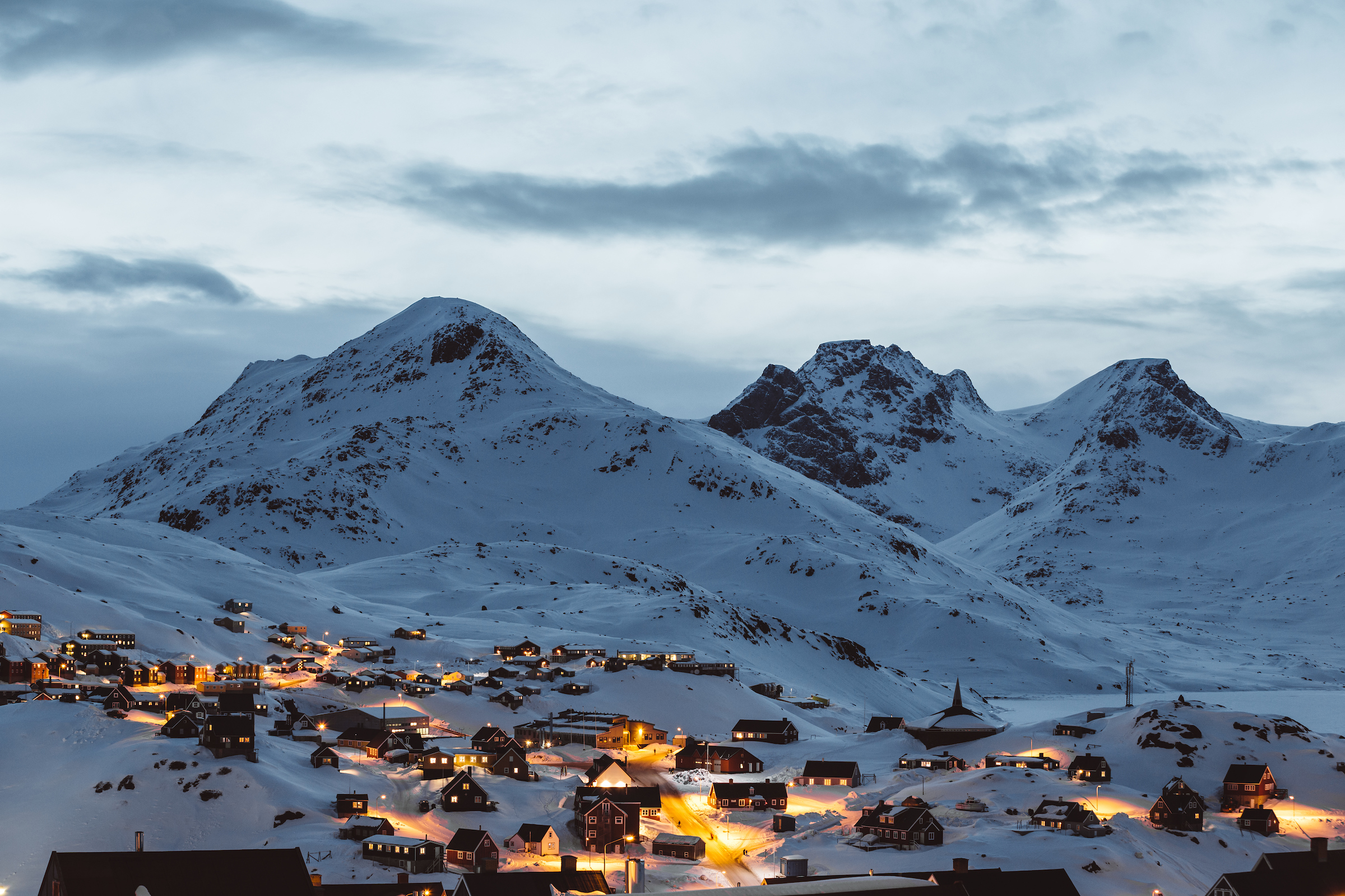 House Lights Illuminating Tasiilaq. Photo Nikolaus Brinkmann , Visit Greenland
